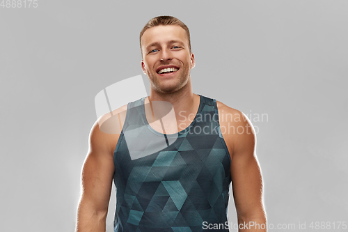 Image of portrait of smiling young man or bodybuilder