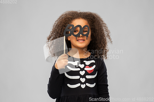 Image of girl in black halloween dress with skeleton bones