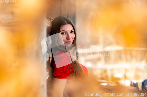 Image of Close-up portrait of a beautiful girl in a red dress