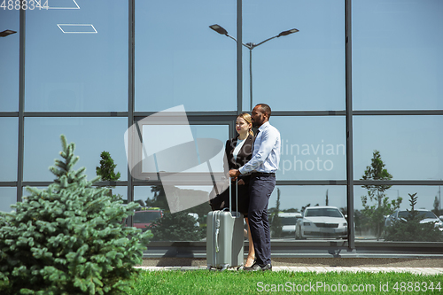 Image of Meeting of young business partners after arriving to end point of business trip