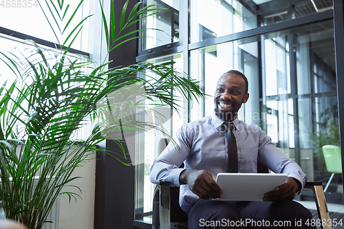 Image of Young businessman after departure in airport, work trip, business lifestyle