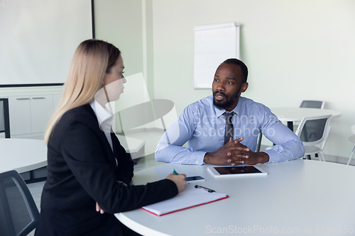 Image of Young businessman waiting for departure in airport, work trip, business lifestyle