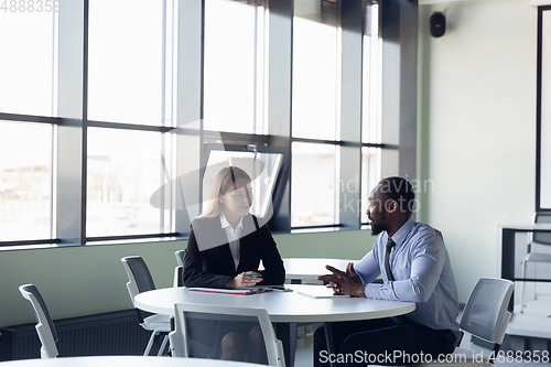 Image of Young businessman waiting for departure in airport, work trip, business lifestyle