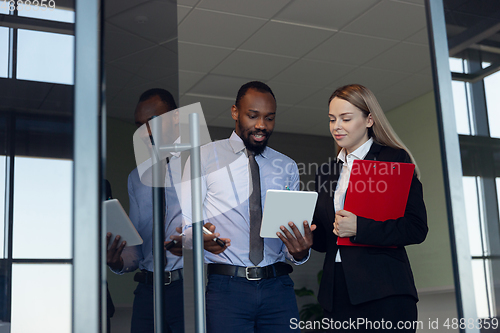 Image of Young businessman waiting for departure in airport, work trip, business lifestyle