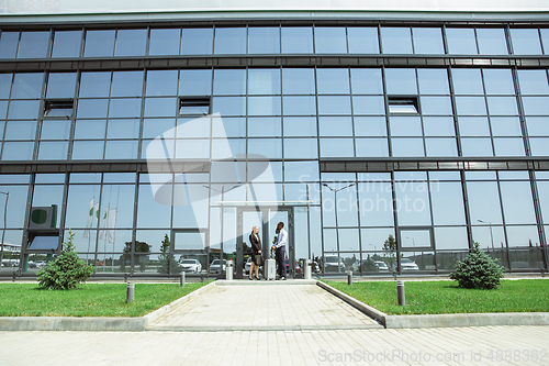 Image of Meeting of young business partners after arriving to end point of business trip