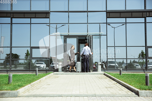 Image of Meeting of young business partners after arriving to end point of business trip