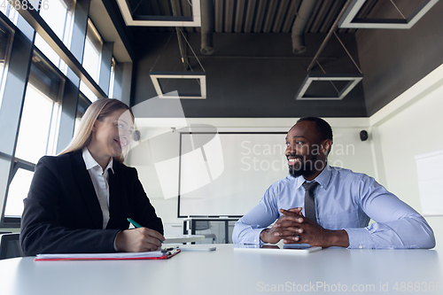 Image of Young businessman waiting for departure in airport, work trip, business lifestyle