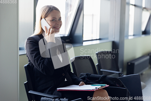 Image of Young businesswoman before departure. Airport, work trip, business lifestyle