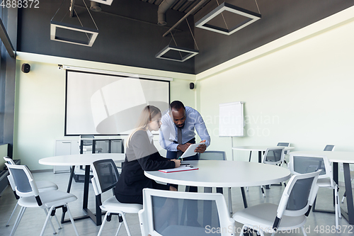 Image of Young businessman waiting for departure in airport, work trip, business lifestyle