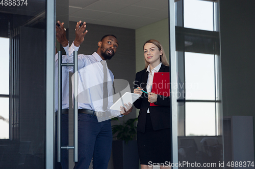 Image of Young businessman waiting for departure in airport, work trip, business lifestyle