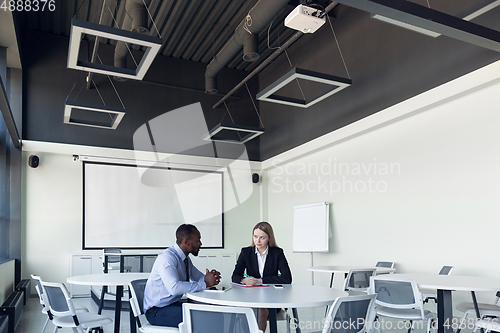 Image of Young businessman waiting for departure in airport, work trip, business lifestyle