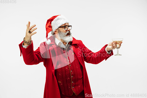 Image of Modern stylish Santa Claus in red fashionable suit isolated on white background