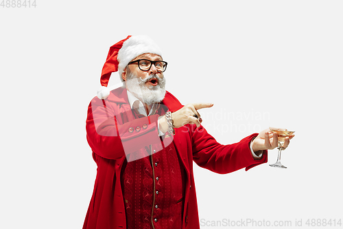 Image of Modern stylish Santa Claus in red fashionable suit isolated on white background