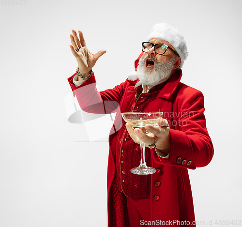 Image of Modern stylish Santa Claus in red fashionable suit isolated on white background