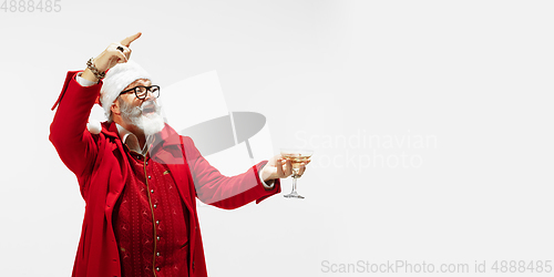 Image of Modern stylish Santa Claus in red fashionable suit isolated on white background