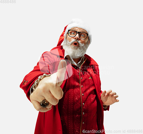 Image of Modern stylish Santa Claus in red fashionable suit isolated on white background