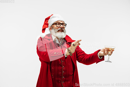 Image of Modern stylish Santa Claus in red fashionable suit isolated on white background