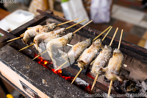 Image of Fish Ayu with salt being charcoal broiled