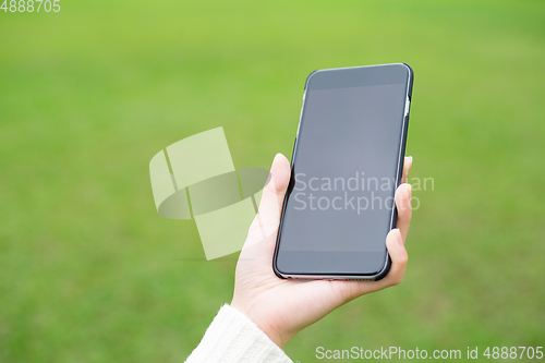 Image of Woman hold with mobile phone