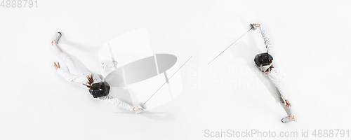 Image of Teen girl in fencing costume with sword in hand isolated on white background, top view