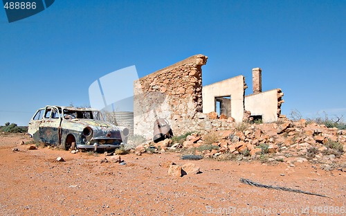 Image of old car and ruins