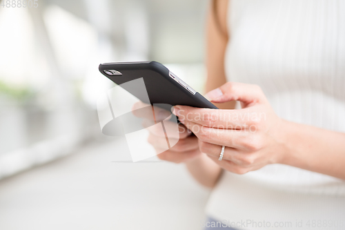 Image of Close up of Woman use of cellphone