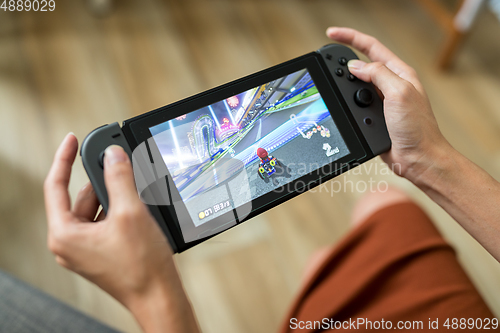 Image of Hong Kong, 16 May 2017 -:Woman playing mario kart 8 on Nintendo 