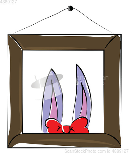 Image of A photo frame hanged in wall showcasing two bunny ears and a red