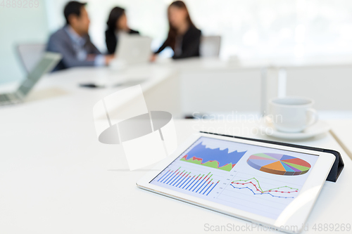 Image of Digital tablet showing data chart in meeting room