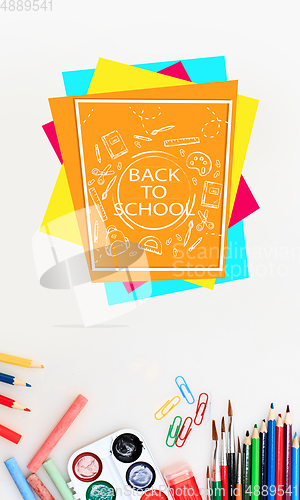 Image of Colorful school supplies corner border over a white background with words Back to school