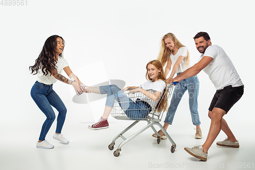 Image of Group of adorable multiethnic friends having fun isolated over white studio background