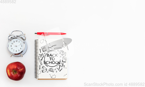 Image of Colorful school supplies corner border over a white background with words Back to school