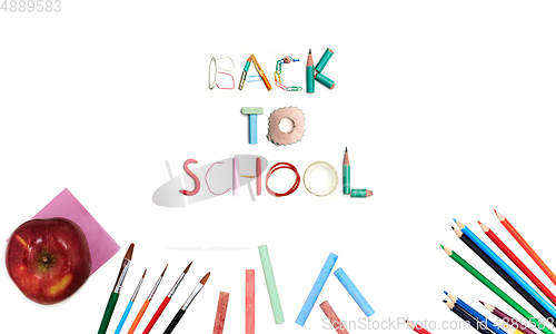 Image of Colorful school supplies corner border over a white background with words Back to school