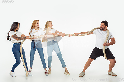 Image of Group of adorable multiethnic friends having fun isolated over white studio background