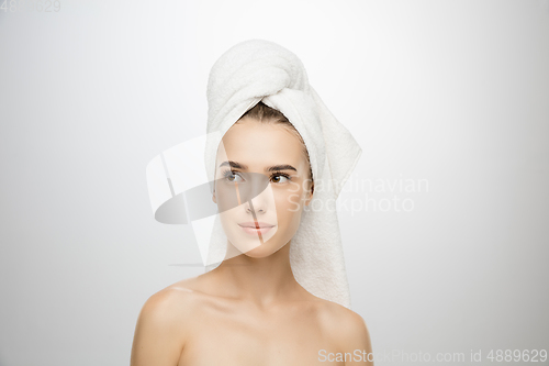 Image of Beauty Day. Woman wearing towel isolated on white studio background