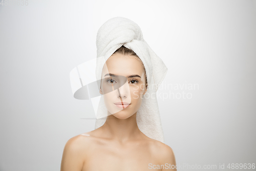 Image of Beauty Day. Woman wearing towel isolated on white studio background