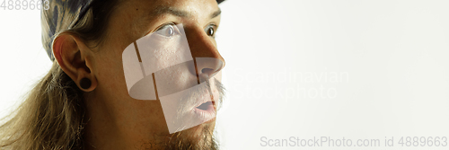 Image of Caucasian young man\'s close up shot on studio background, flyer