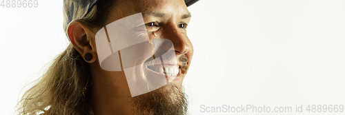 Image of Caucasian young man\'s close up shot on studio background, flyer