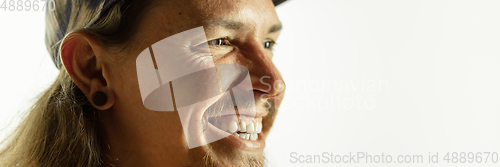 Image of Caucasian young man\'s close up shot on studio background, flyer