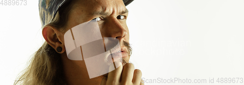 Image of Caucasian young man\'s close up shot on studio background, flyer