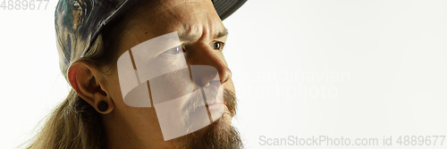 Image of Caucasian young man\'s close up shot on studio background, flyer