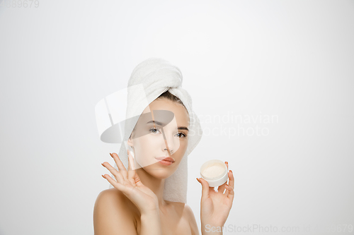 Image of Beauty Day. Woman wearing towel isolated on white studio background