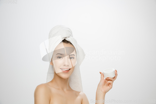 Image of Beauty Day. Woman wearing towel isolated on white studio background