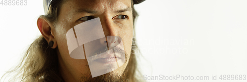 Image of Caucasian young man\'s close up shot on studio background, flyer