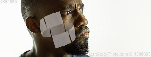 Image of African-american young man\'s close up shot on studio background, flyer