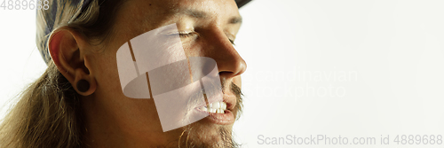 Image of Caucasian young man\'s close up shot on studio background, flyer