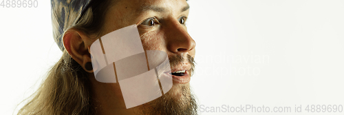 Image of Caucasian young man\'s close up shot on studio background, flyer