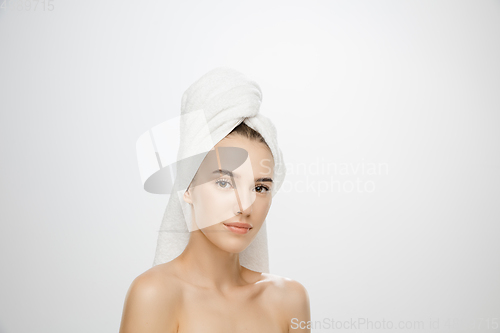 Image of Beauty Day. Woman wearing towel isolated on white studio background
