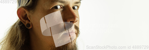 Image of Caucasian young man\'s close up shot on studio background, flyer