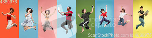 Image of Collage of portraits of young jumping people on multicolored background in motion and action